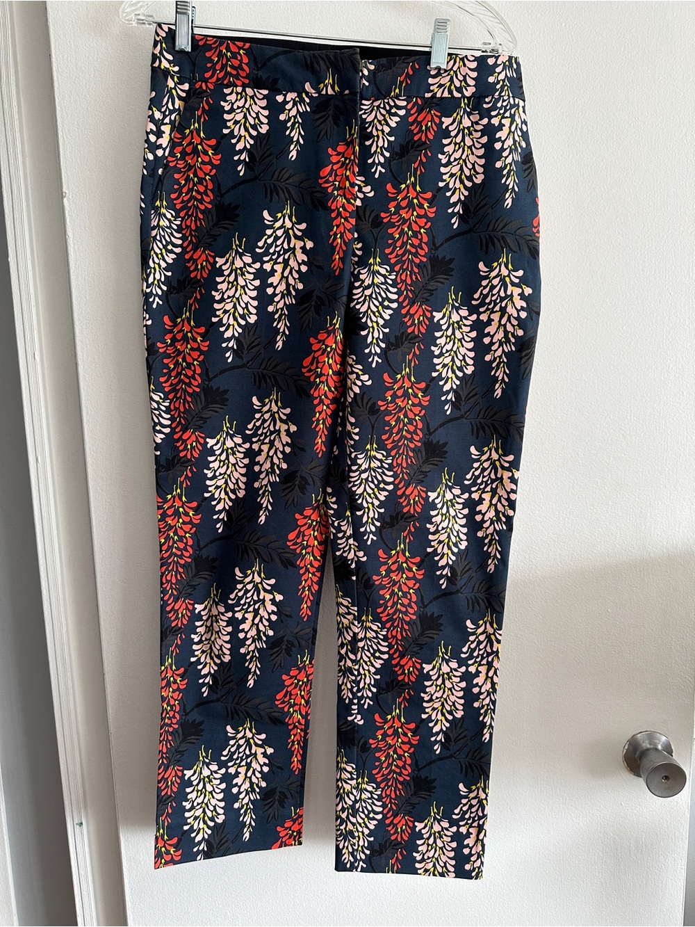 Boden Navy Floral Slim Pants with Red and Pink Blooms.